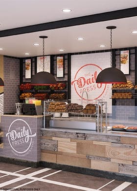 Freshly prepared food at Daily Kneads restaurant counter with reclaimed wood decor