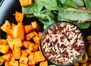 Roasted sweet potatoes and brown rice with spinach, a nutritious plant-based meal option
