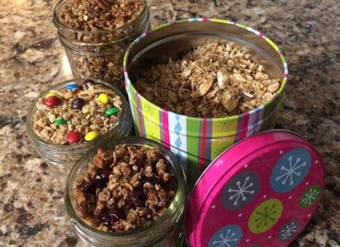 Holiday granola in colorful tin containers for festive gift-giving from Morrison Healthcare