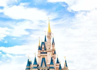 Cinderella Castle at Walt Disney World under a blue cloudy sky