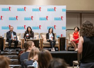 Four Morrison Healthcare executives speaking on a panel at the Partnership for a Healthier America conference