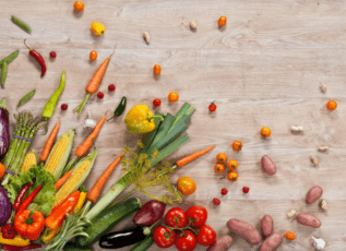 Colorful fresh vegetables on wooden table for healthy cooking