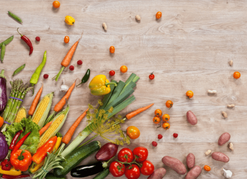 Colorful fresh vegetables on wooden table for healthy cooking
