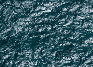 Aerial view of rugged ocean waves and ripples surface texture