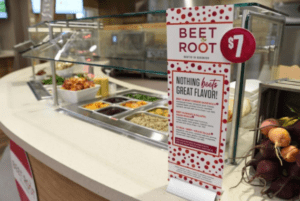 Beet root station at Morrison Healthcare cafe with fresh salad bar and ingredient info sign