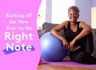 Senior woman smiling while exercising with fitness ball at home, kicking off New Year on right note