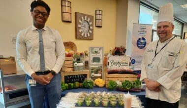 Morrison Healthcare chefs display fresh farm produce for healthy meals at healthcare facility