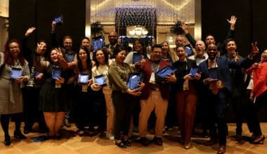 Morrison Healthcare associates holding tablets at event