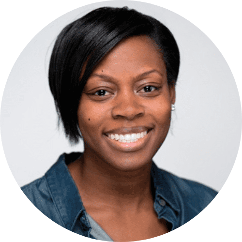 Portrait of smiling African American woman with short black hair wearing denim shirt