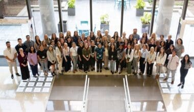 Group photo of Morrison Healthcare employees in an office atrium