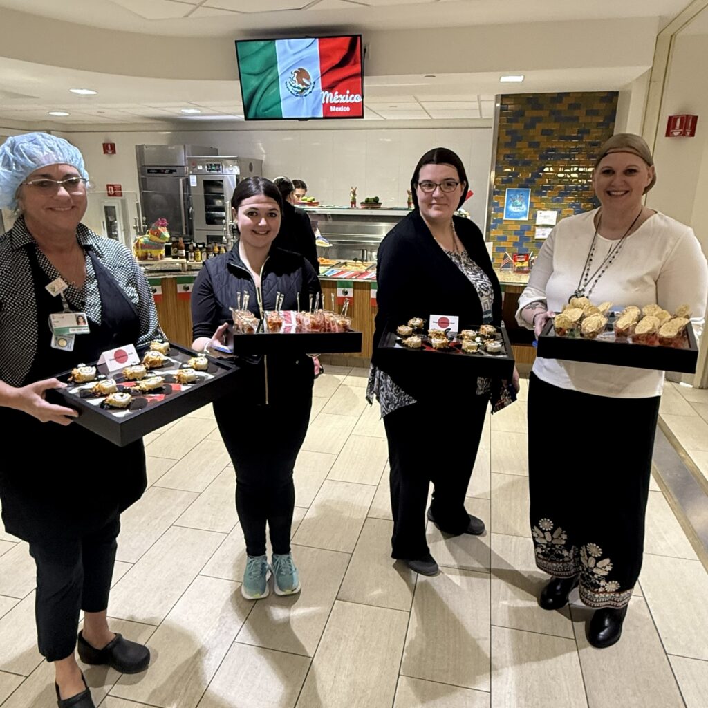 Morrison Healthcare associates with mulicultural food at Northern Light